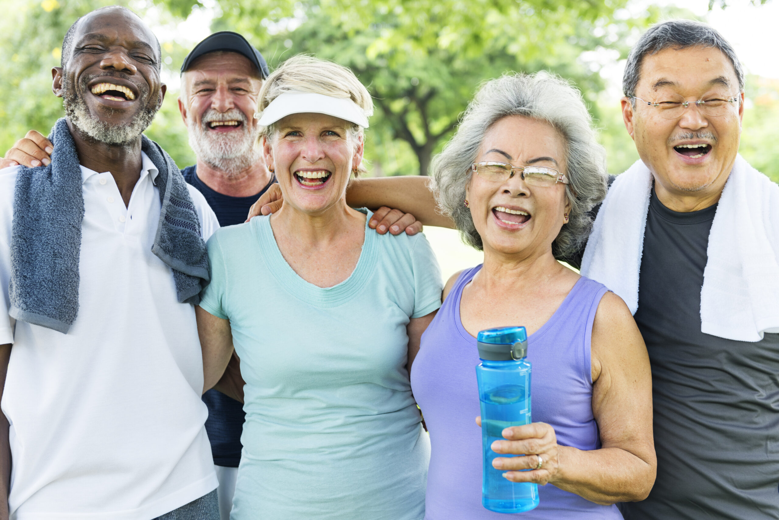 The photo shows a group of five seniors in exercise clothes who look happy.