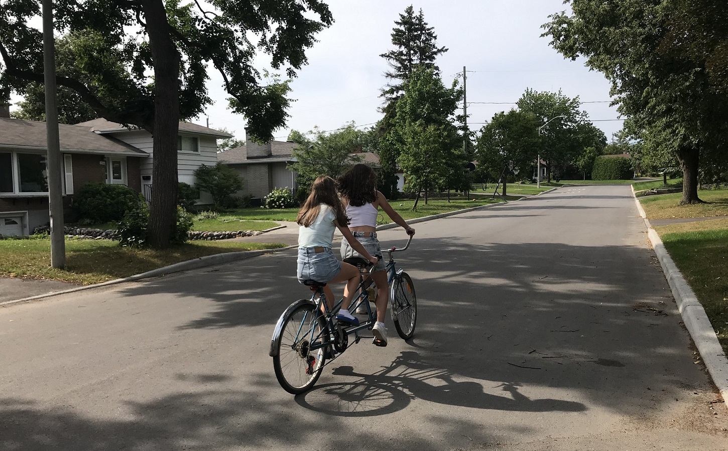 girls riding a tandem bike