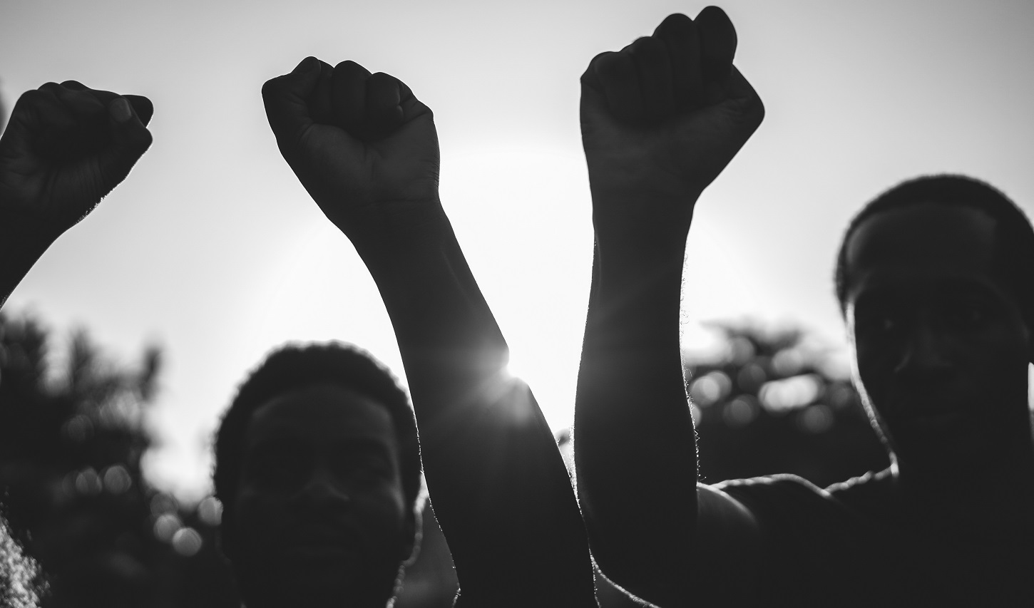 Black demonstrator people holding hands against racism