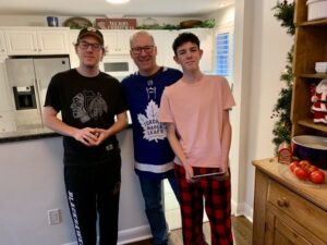 Shane connecting with his sons Ethan and Dillon over the holidays