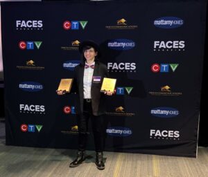 Roxanne accepts their award