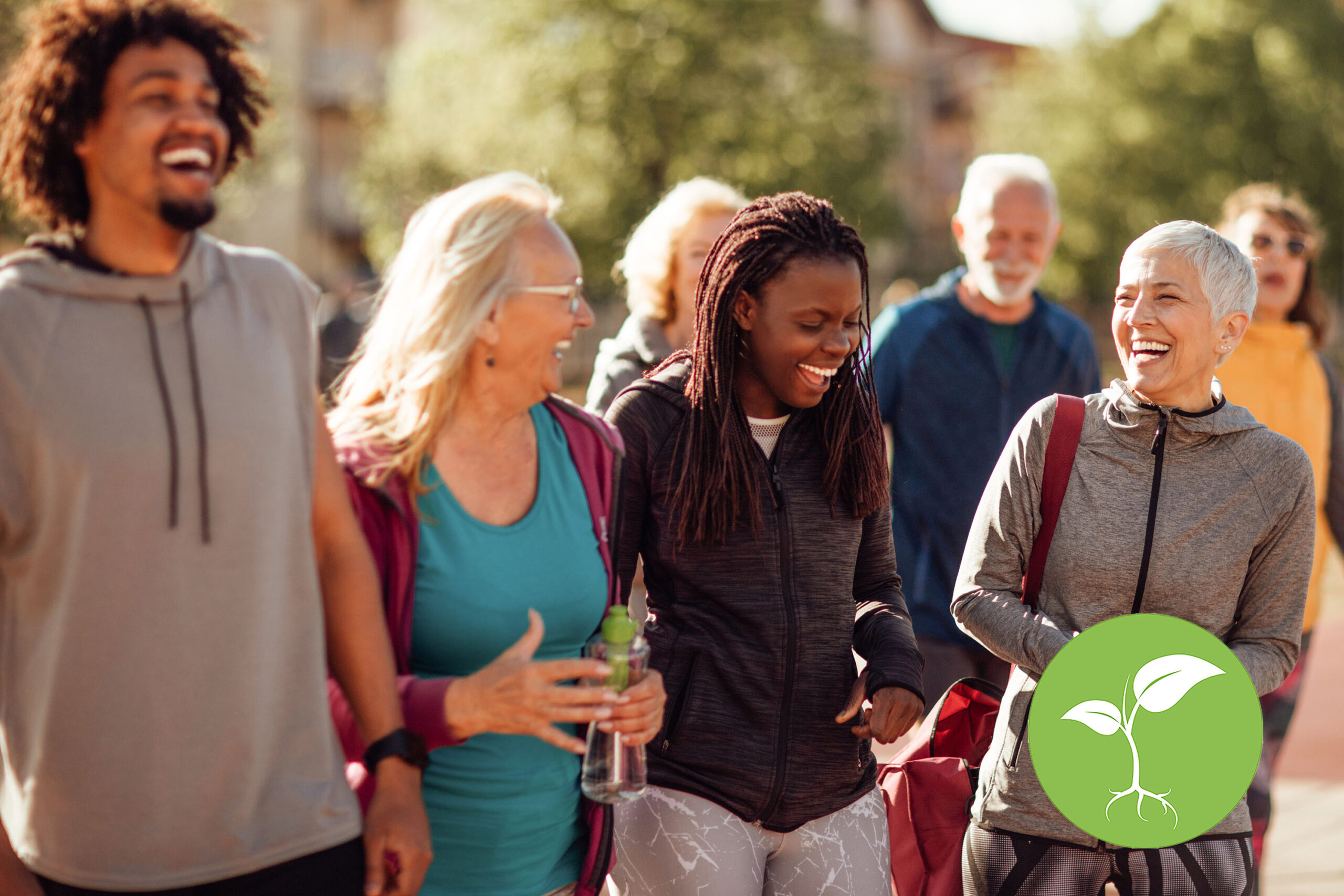 Smiling group of people walking together outdoors |