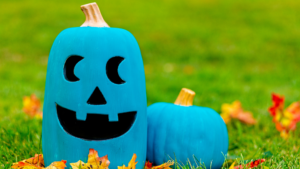 A teal pumpkin and a teal jack-o-lantern