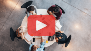 A group of students sitting at a table working on a paper
