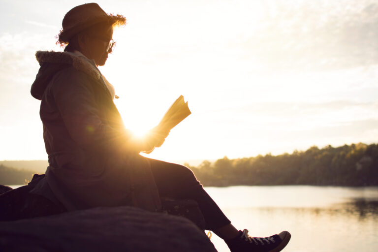 Woman reading a book in nature