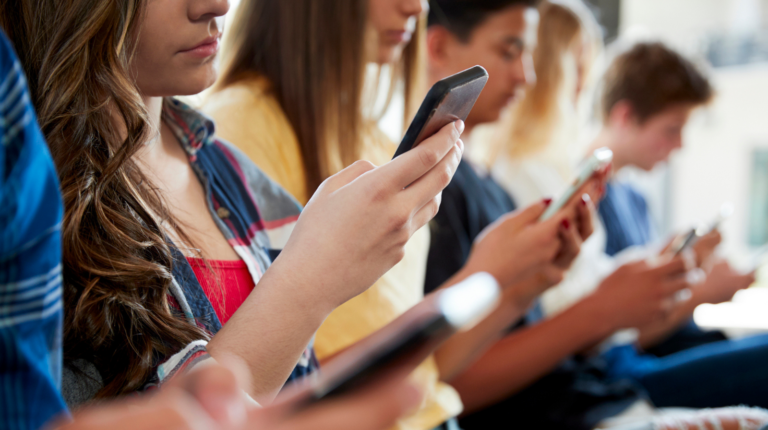 Students looking at their cellphones