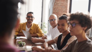 People sitting around a table discussing.
