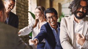 A group of people shaking hands.