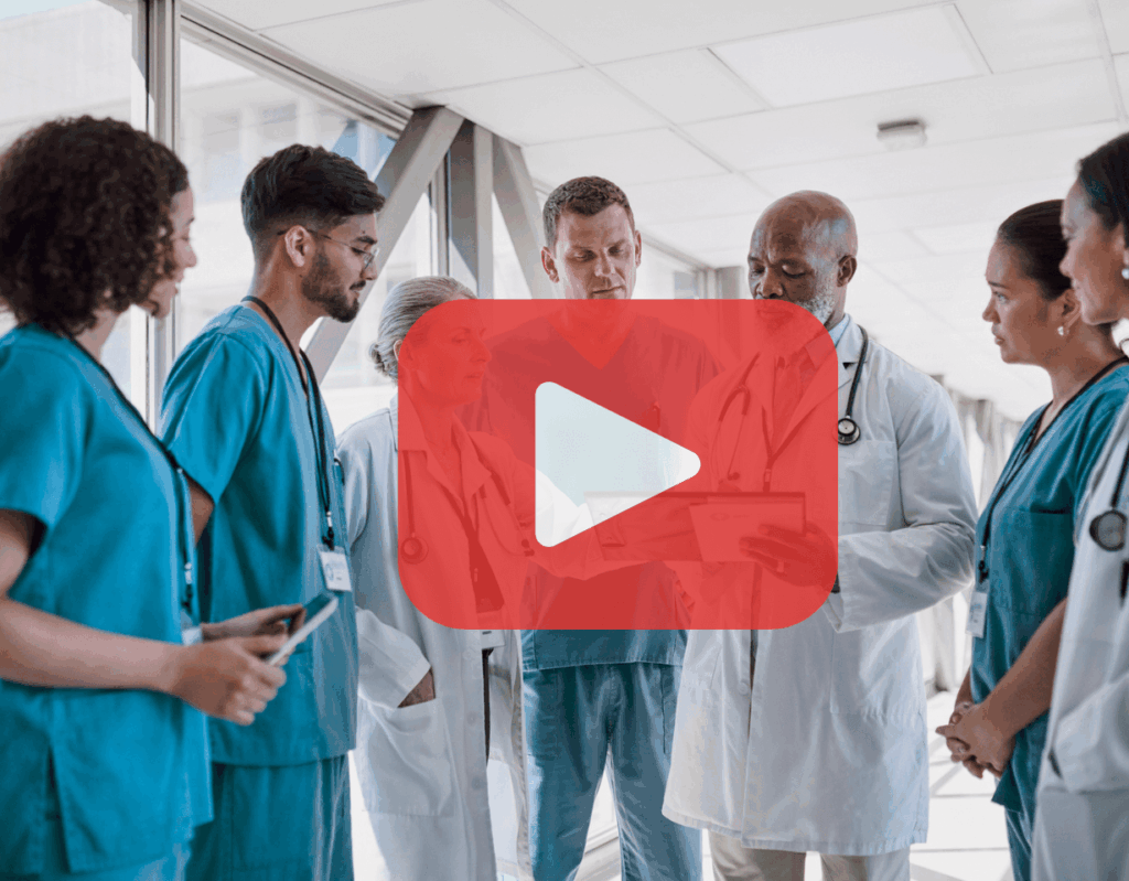 Nurses and doctors discussing in a hallway