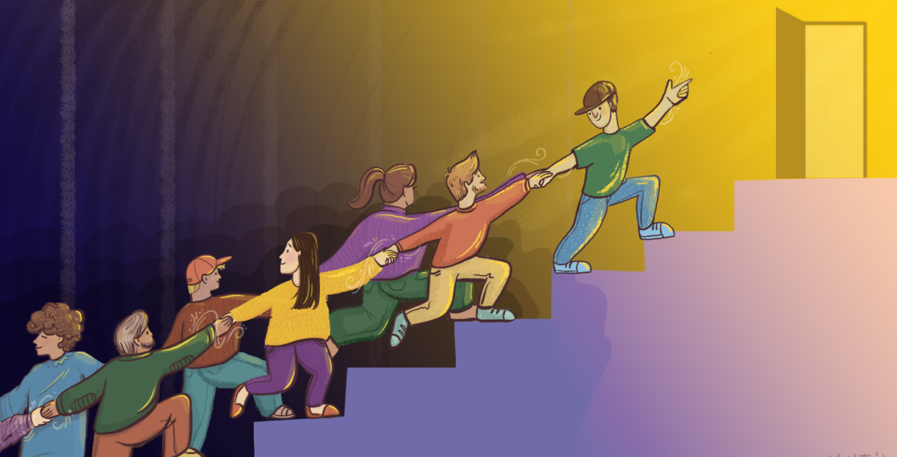 Men and women working together to overcome a difficult obstacle