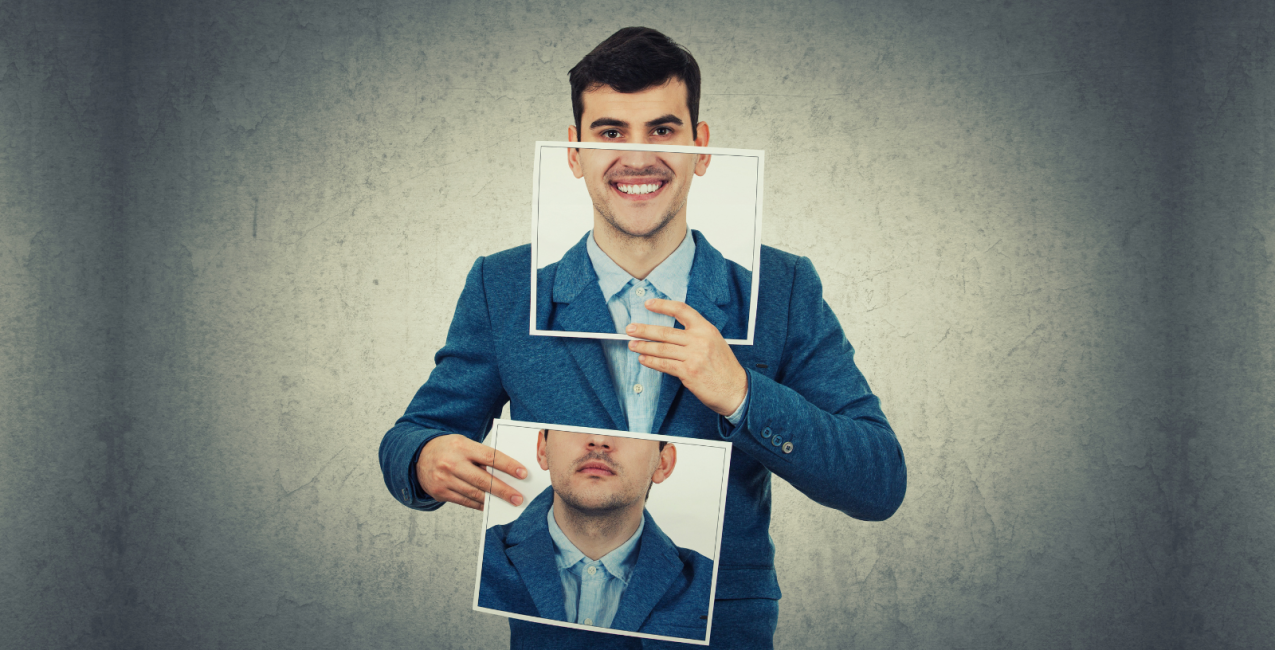 Main Image Businessman holding two white photo sheets with different portrait emotions, one hiding half face with angry expression on and another with a happy, smiling face