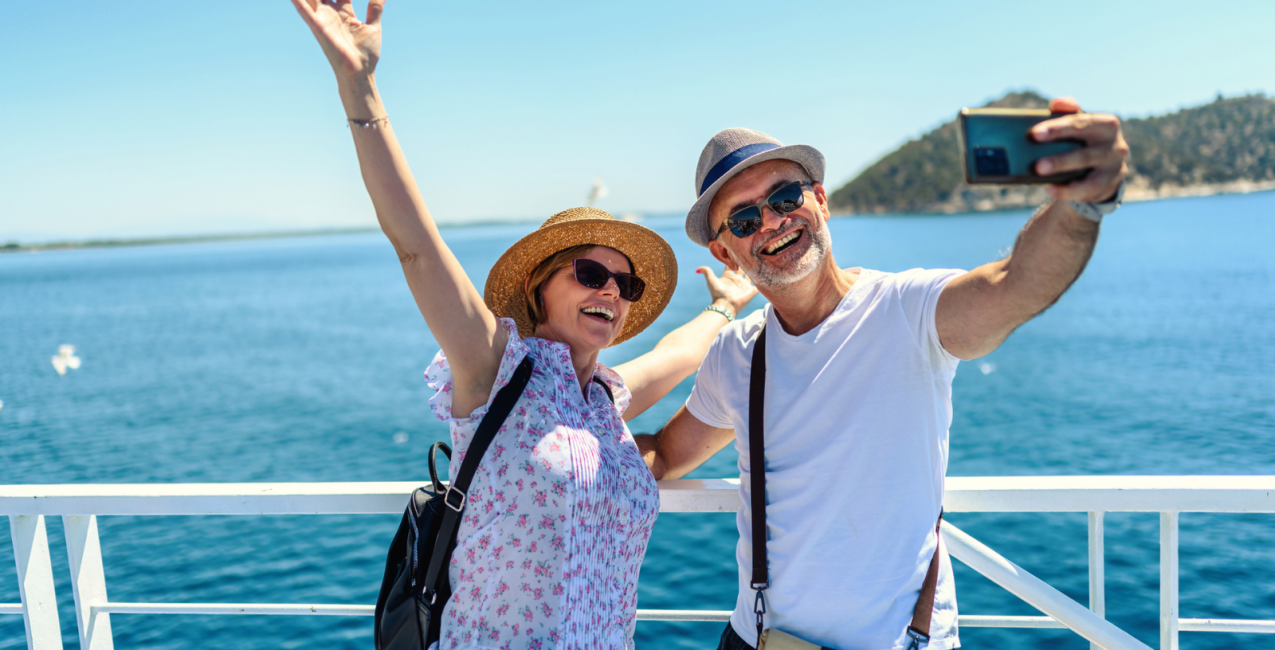 Older adults taking a selfie on a boat
