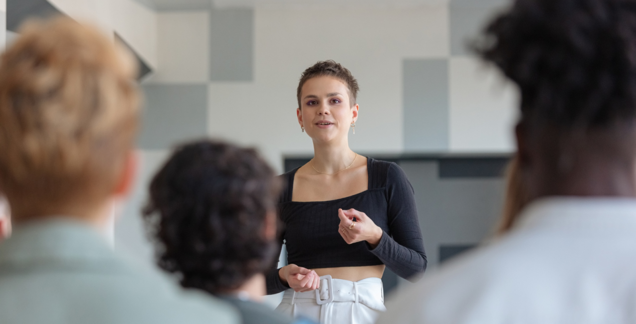 Main Image A woman presenting to her peers